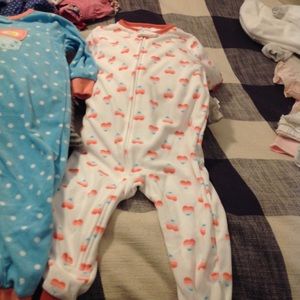 Two pairs of footless, fleece pajamas.